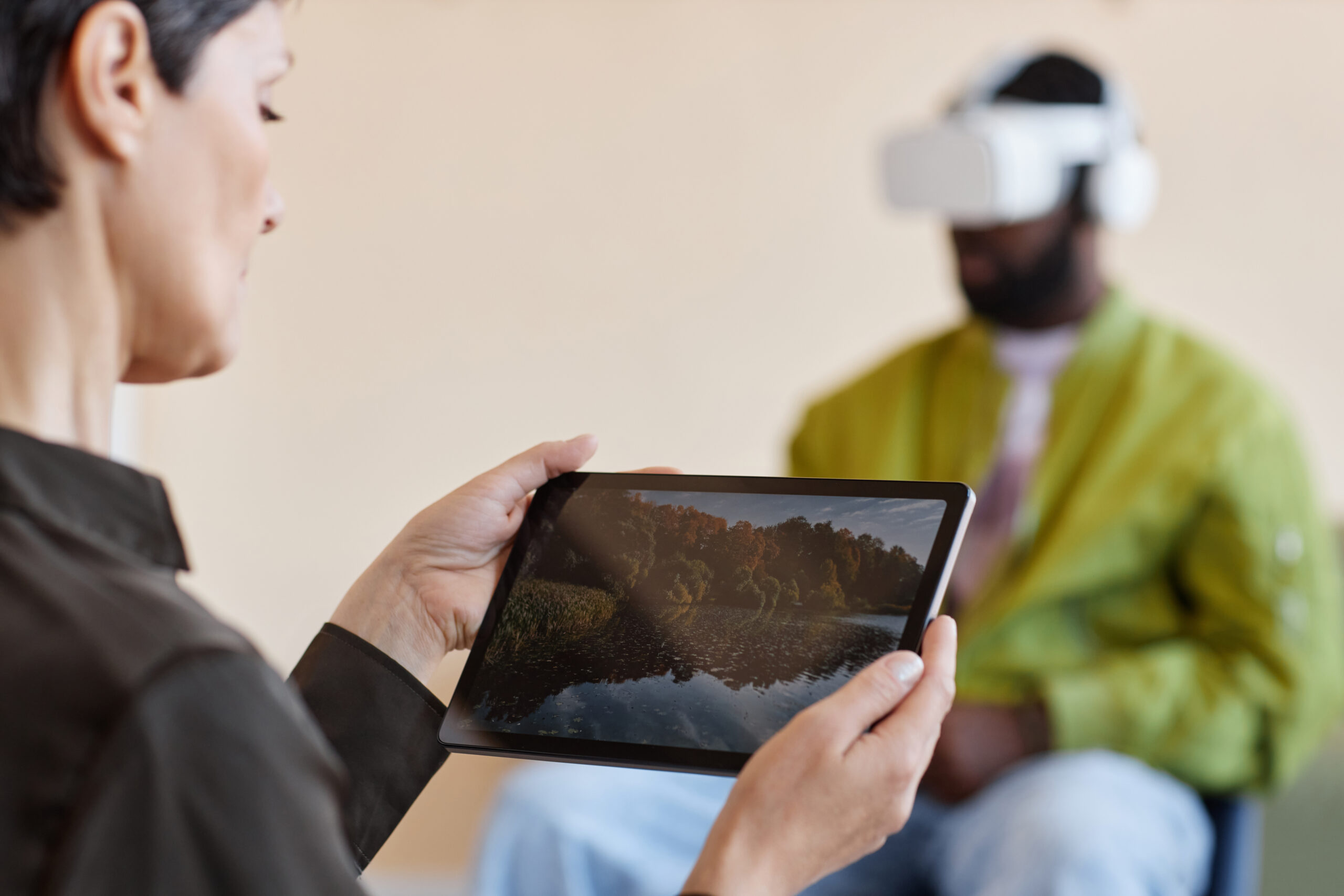 Psychologist using tablet pc during virtual psychotherapy session with people